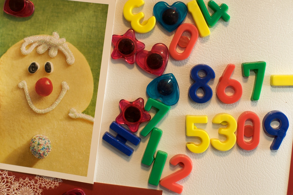 Refrigerator magnets spell out a phone number from the popular 80s song "Jenny."