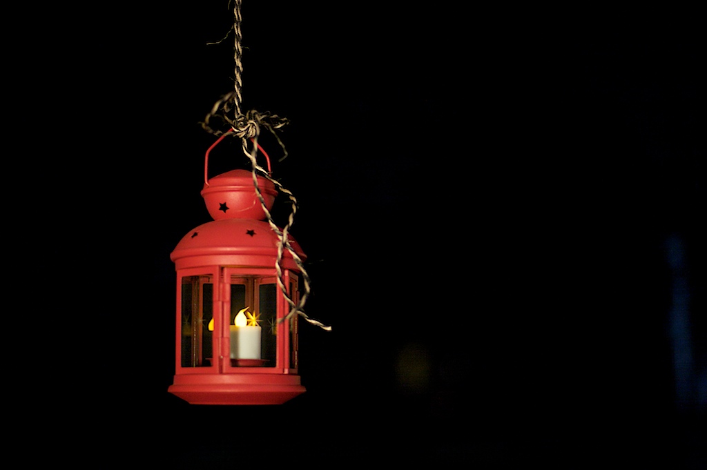 A holiday lantern brings a bit of light to a dark December night in Mobile, Ala., Thursday, Dec. 10, 2009.