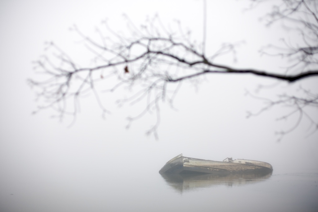An abandoned boat sits in the water of the Tensaw River just east of downtown Mobile, Ala., Monday, Dec. 14, 2009. In Alabama, abanonded vessels can be left behind in waterways, as long as they are not blocking a channel or leaking hazardous materials.