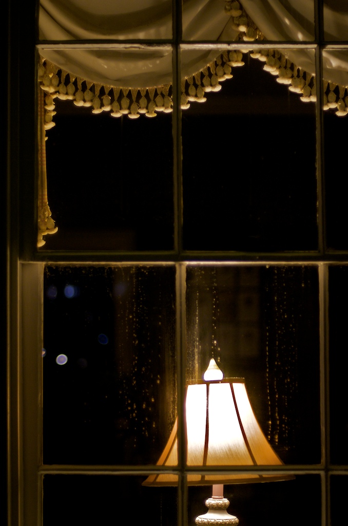 A lamp brightens the window of the Alumni Hall building on the University of South Alabama campus Wednesday night, Dec. 30, 2009.