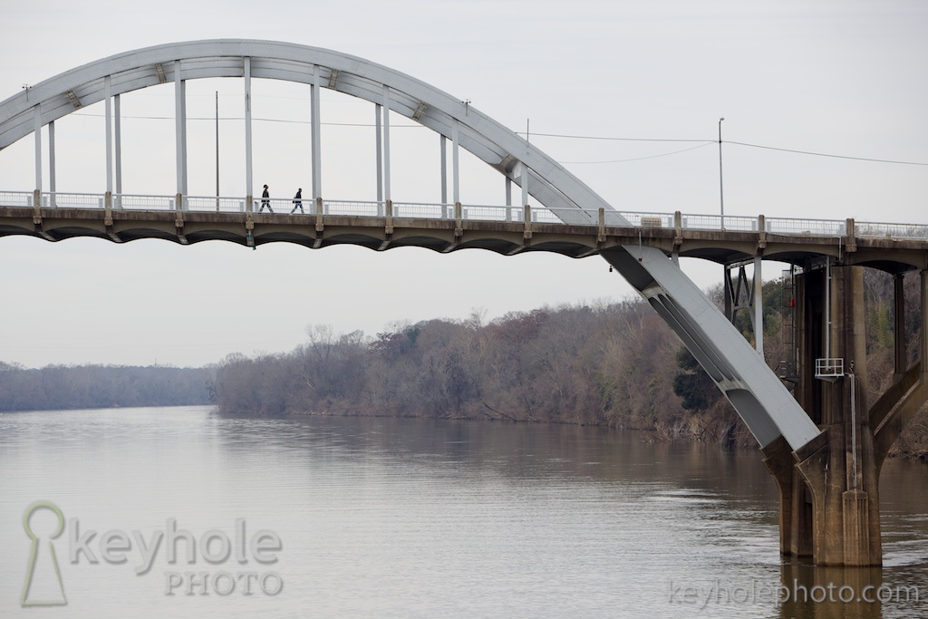 People walk across the Edmund Pettus Bridge in Selma, Ala., hours before the start of the annual Bridge Crossing for Bloody Sunday March 7, 2010.