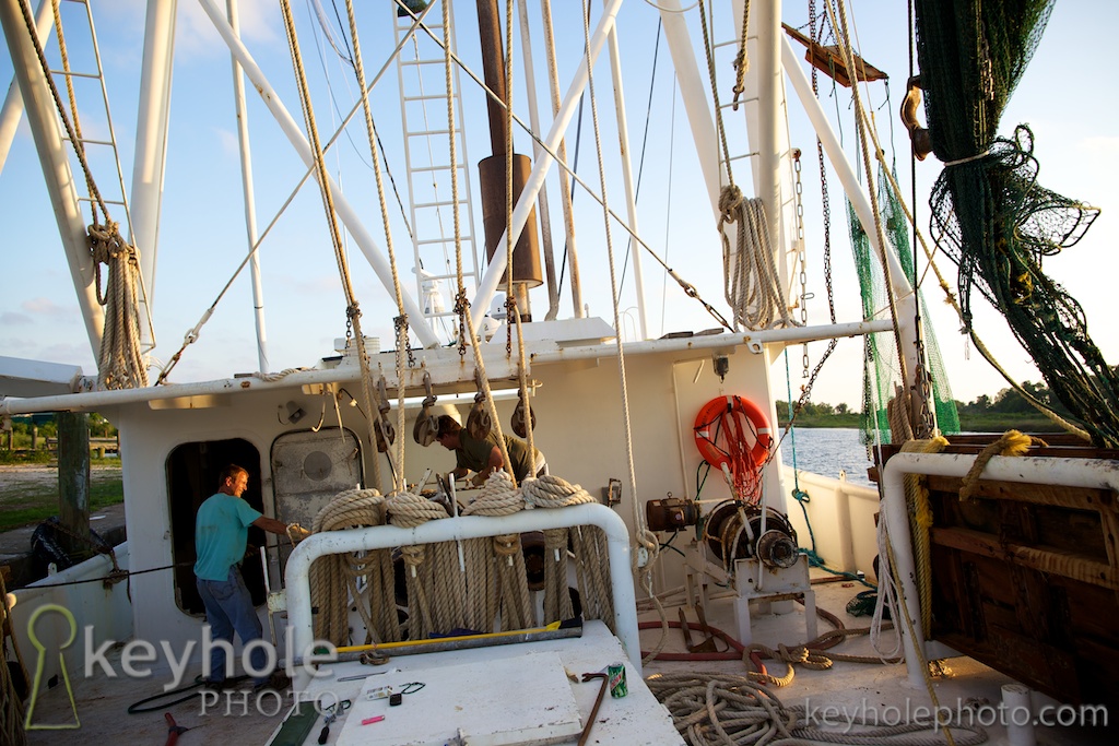 Dominick Ficarino, Jonathan Wilkerson, Thomas Wilson and Roy Wilkerson pull cable onto the Miss Ashleigh fishing boat in Bayou la Batre, Ala., Friday evening, May 7, 2010.