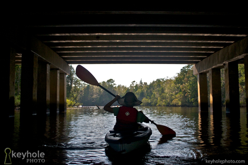 Kayaking under a bridge