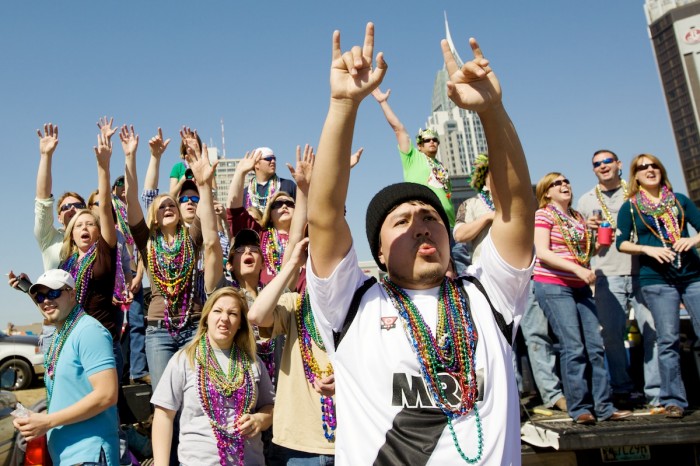 People celebrate Mardi Gras Day at parades in downtown Mobile, Ala., Sunday, February 22, 2009.