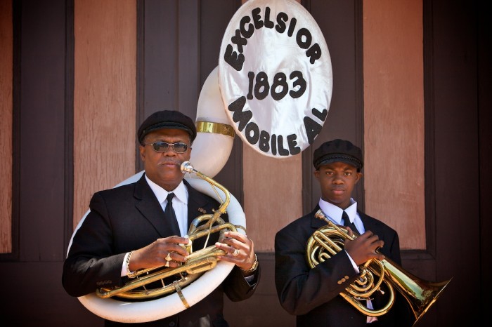 Charles Hall and his grandson, James Brown, are members of The Excelsior Band, which started in 1883, and has been a part of Mobile Mardi Gras parades for over a century. Members of the band were photographed in front of the Phoenix Fire Museum, and as they performed during the Floral Parade, February 21, 2009.