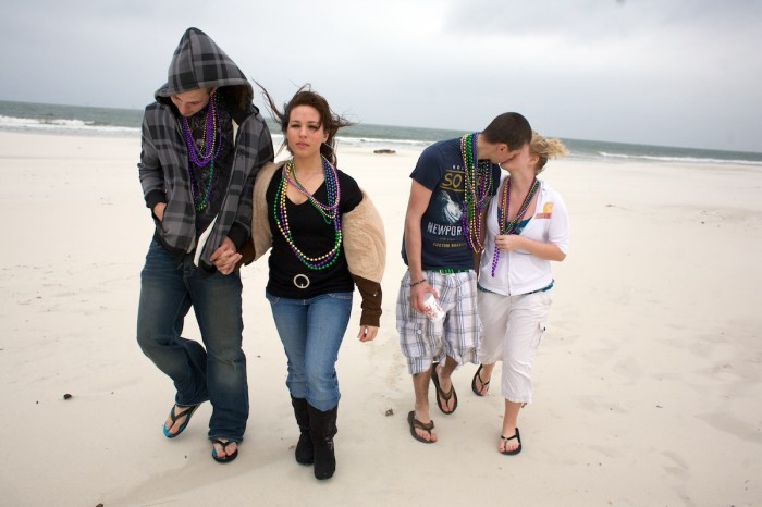 Jayce Findley, right, kisses Candice Trent as they walk along the beach at Dauphin Island with Wendell Chasse and Michealla Cain Saturday, Jan. 24, 2010. The four had just attended the Mardi Gras parades.Island Mystics and Krewe de la Dauphine parade through Dauphin Island, Ala., Saturday, January, 23, 2010.