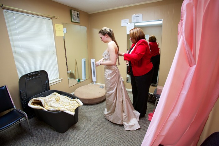 Christal Hall of Seams to Fit alters debutante Virginia Bedwell's coronation gown to accommodate her train.