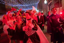 Debutantes dressed as their "suppressed desires" parade through the streets of downtown Mobile, Ala., to the Dominoes Double Rush Ball at the Athelstan Club, Saturday, January 12, 2013.