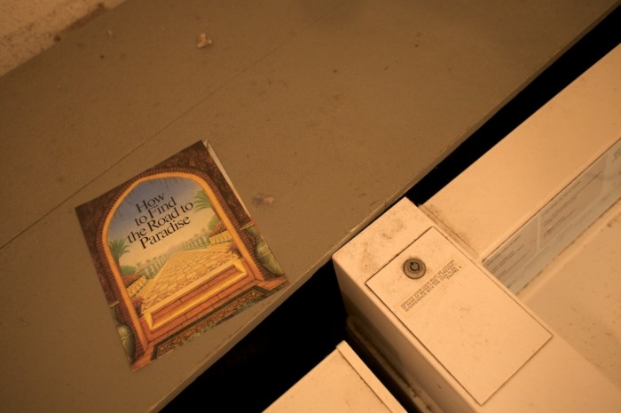 A tract about finding the road to paradise sits left behind in a laundry room at apartments on Dauphin Street in Mobile, Ala., Tuesday, Sept. 22, 2009.