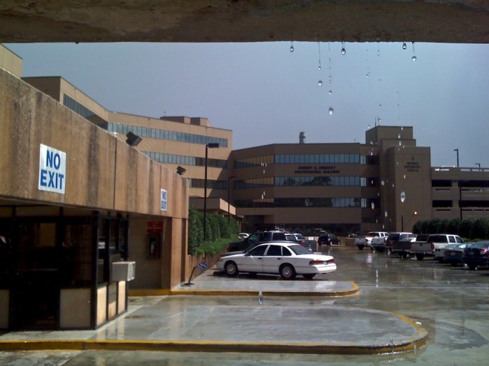 Rain drops fall from a walkway at the Mobile Infirmary in Mobile, Ala., Monday, Oct. 12, 2009.