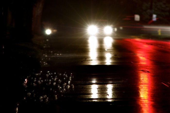 Bubbles form on the surface of a rain puddle as a car sits at a red traffic light in Mobile, Ala., Friday night, Oct. 9, 2009.