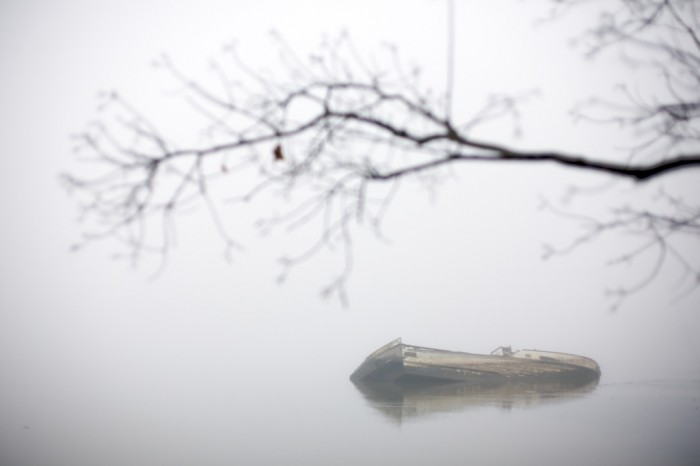 An abandoned boat sits in the water of the Tensaw River just east of downtown Mobile, Ala., Monday, Dec. 14, 2009. In Alabama, abanonded vessels can be left behind in waterways, as long as they are not blocking a channel or leaking hazardous materials.