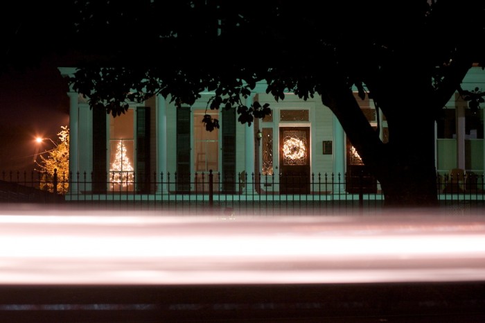 A car passes by a home on Dauphin Street Monday night, Dec. 21, 2009, in Mobile, Ala.