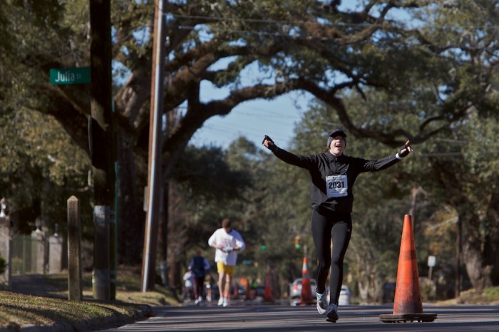 A runner comes down the homestretch on Dauphin Street of the First Light Marathon in Mobile, Ala., Sunday, Jan. 10, 2010.