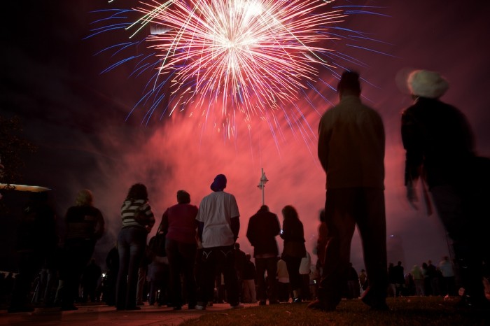 People watch the fireworks for the Moonpie over Mobile New Year's Eve celebration in downtown Mobile, Ala., Friday, Jan. 1, 2010.