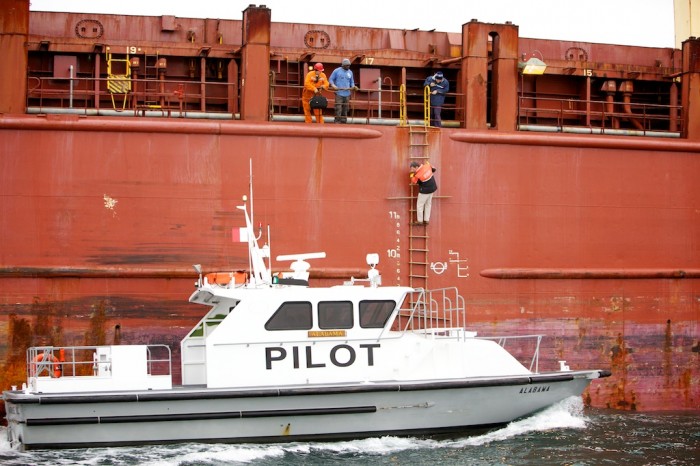 Bar pilot climbing off ship