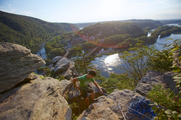Joe Enfonde of Charles Town, W. Va., rappels down the rocks of the Overlook Cliff above Harpers Ferry, W. Va.