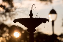 Water splashes from a fountain on the campus of Spring Hill College as the sun rises over Mobile, Ala., Friday, Dec. 12, 2014.