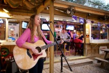 Girl performing music at Old 27 Grill